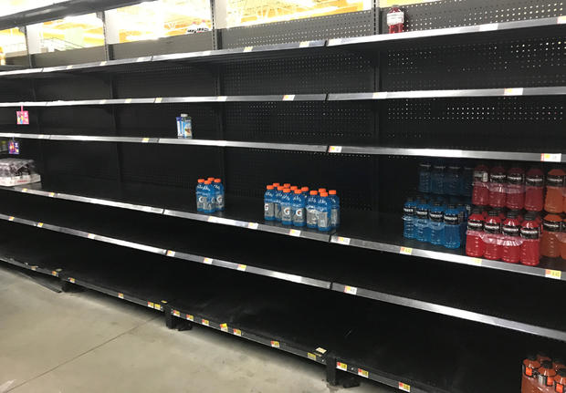 Shelves sit nearly empty in a Walmart store as residents stock ahead of Hurricane Harvey approaching landfall near the Texas coastal area, in Houston 