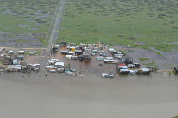 Housing surrounded by flood waters is seen from a U.S. Coast Guard helicopter during an overflight from Port Aransas to Port O'Connor 
