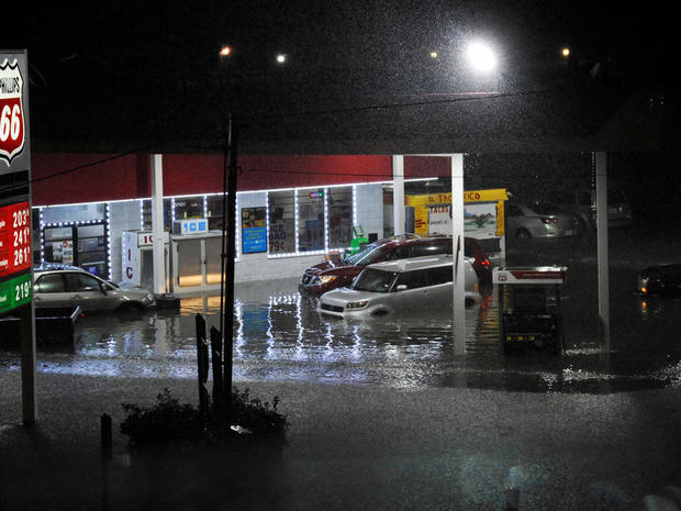 Cars sit abandoned at a flooded gas station after Hurricane Harvey made landfall on the Texas Gulf coast and brought heavy rain to the region 