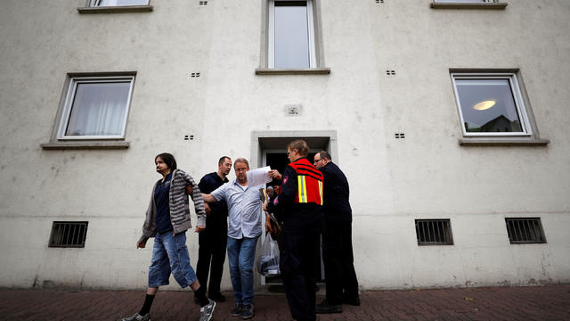 Firefighters and police officers observe the evacuation of Sister Sigrid's nursery home as 60,000 people in Germany's financial capital are about to evacuate the city while experts defuse an unexploded British World War Two bomb in Frankfurt 