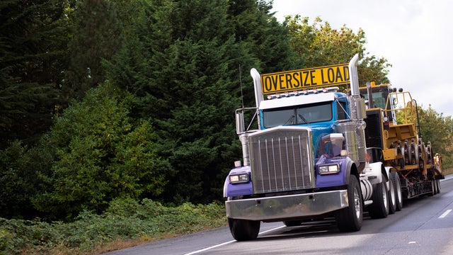 Oversize load rig semi truck with step down flat bed 