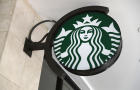 A Starbucks sign is seen at one of their stores on July 28, 2017, in Miami, Florida. 