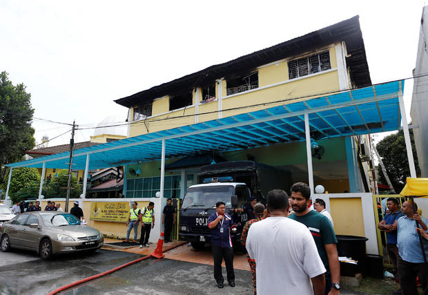 Authorities work at religious school Darul Quran Ittifaqiyah after a fire broke out in Kuala Lumpur 