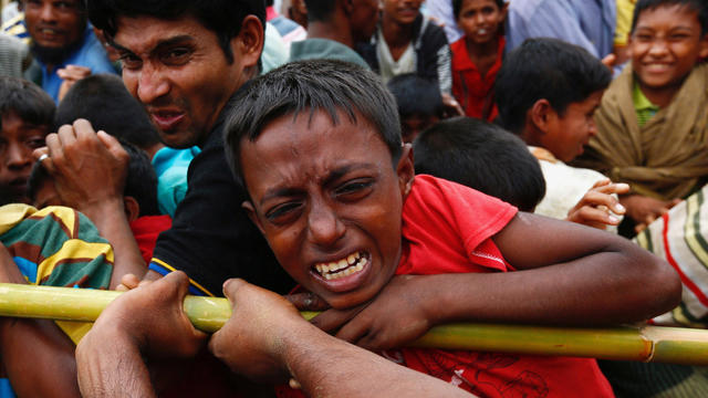 A Rohingya refugee boy jostles for aid in Cox's Bazar 