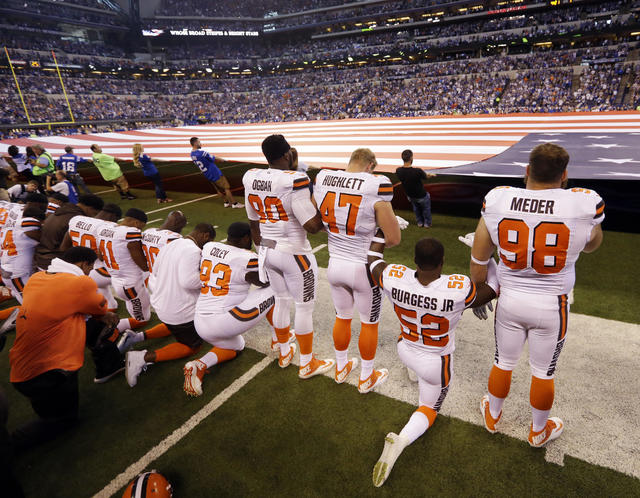 NFL: Raiders link arms, some Panthers kneel for national anthem