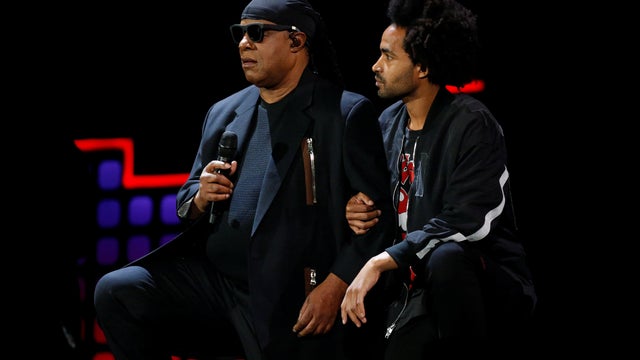 Singer Stevie Wonder takes a knee before performing at the 2017 Global Citizens Festival at Central Park in New York 