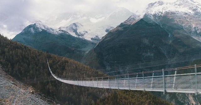 Longest pedestrian suspension bridge soars over Swiss Alps valley - CBS ...