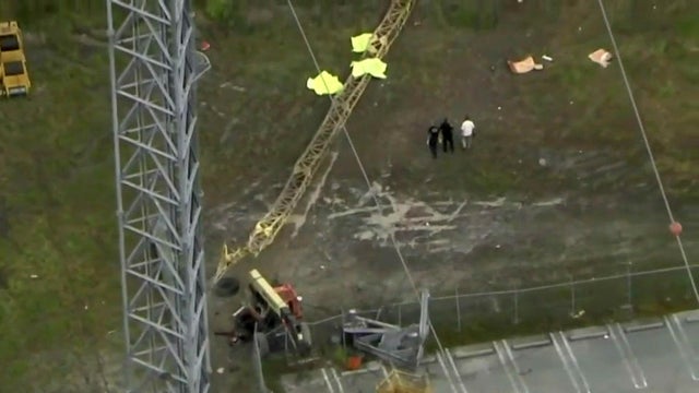 Aerial footage shows crews working the scene after three workers fell from a transmission tower in Miami Gardens, Florida, on Sept. 27, 2017. 