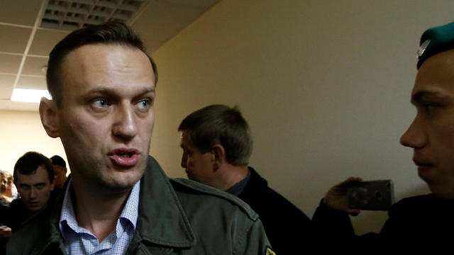 Russian opposition leader Alexei Navalny leaves a hearing after he was detained by police as he left his Moscow home on Friday to take part in a pre-election rally in Nizhny Novgorod, at a court in Moscow 