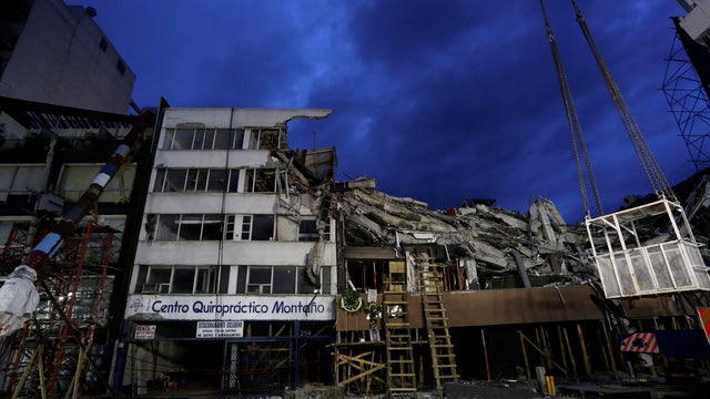 The remains of a building collapsed in an earthquake are seen after rescue teams retrieved the last body trapped in the rubble, in Mexico City 