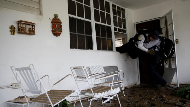 Members of the Massachusetts Task Force 1 conduct a search operation at an area hit by Hurricane Maria in Yauco 