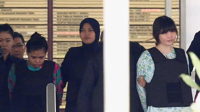 Vietnamese Doan Thi Huong and Indonesian Siti Aisyah who are on trial for the killing of Kim Jong Nam, the estranged half-brother of North Korea's leader, are escorted as they leave the Shah Alam High Court on the outskirts of Kuala Lumpur 