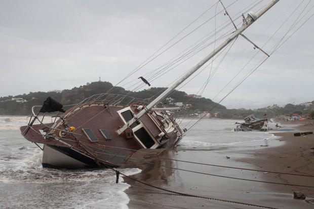 A damaged boat is pictured on the shore of  San Juan del Sur Bay 