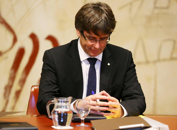 Catalan President Carles Puigdemont presides over a cabinet meeting at the regional government headquarters, the Generalitat, in Barcelona 