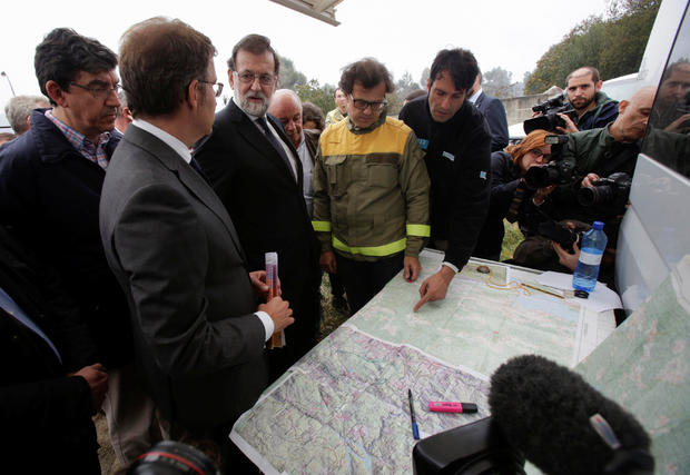 Spain's Prime Minister Mariano Rajoy visits a fire fighitng command center in Pazos de Borben, Galicia, northern Spain 