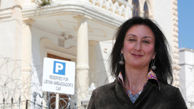 Maltese investigative journalist Daphne Caruana Galizia poses outside the Libyan Embassy in Valletta 