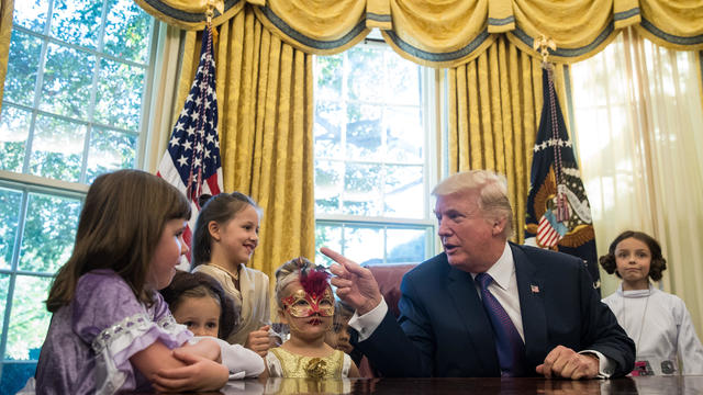 President Trump Hosts Children Of White House Journalists In Oval Office For Halloween 