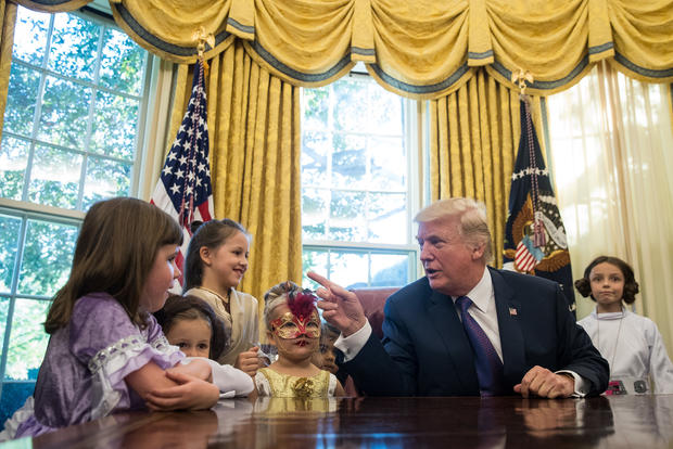 President Trump Hosts Children Of White House Journalists In Oval Office For Halloween 