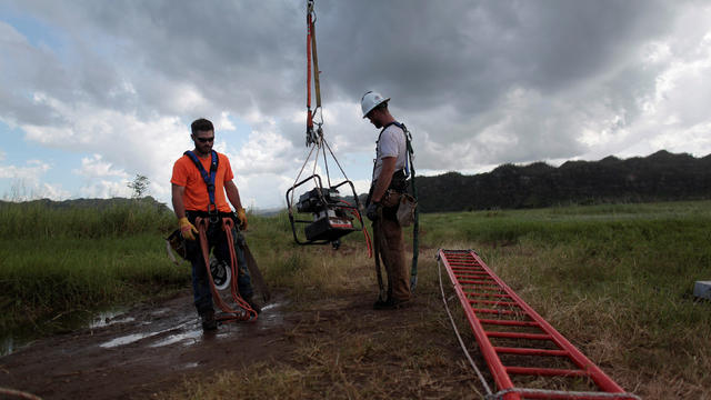 Workers from Montana-based Whitefish Energy Holdings help fix the island's power grid, damaged during Hurricane Maria in September, in Manati 