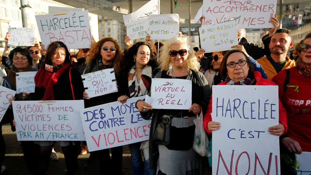 Women hold placards during a gathering against gender-based and sexual violence in Marseille 