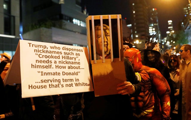 People are dressed in costumes for the New York City Halloween parade in New York City 