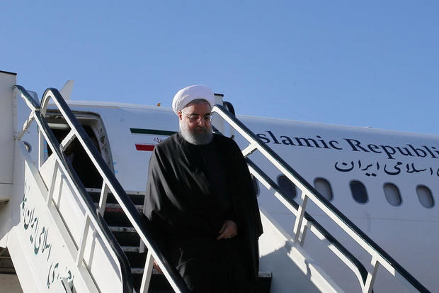 Iranian President Hassan Rouhani walks down aircraft steps as he arrives at Kermanshah that was hit by a powerful earthquake 
