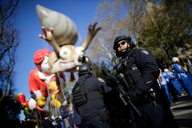 New York Police Officers stand guard during the 91st Macy's Thanksgiving Day Parade in the Manhattan borough of New York City