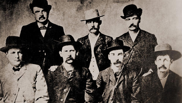 'Dodge City Peace Commissioners' were a gang of gunfighters, lawmen, and saloon owners who fought to keep Dodge City corrupt and under their control. (L to R): Charles Bassett, W. H. Harris, Wyatt Earp, Luke Short, L. McLean, Bat Masterson, Neal Brown. Ca 