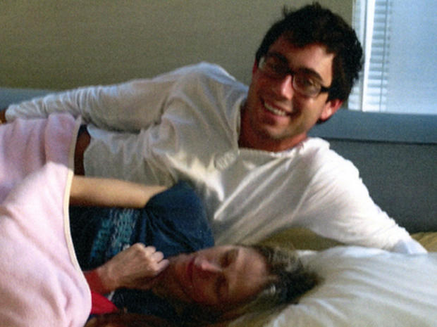 Jake Nolan and Dr. Pamela Buchbinder in her bed 