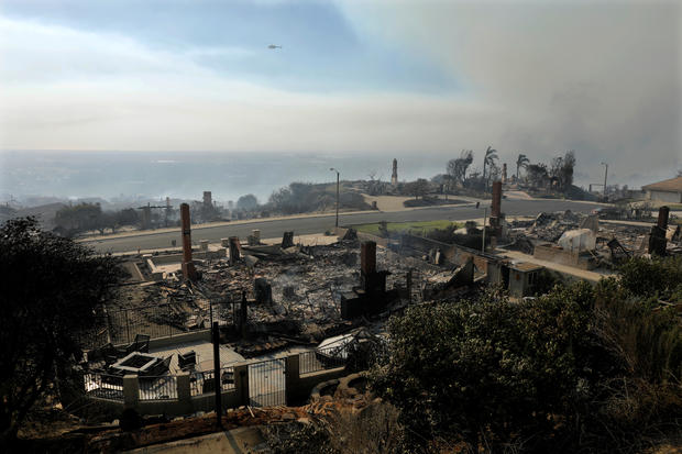 Remains of homes seen after wind-driven wildfire in Ventura, California 