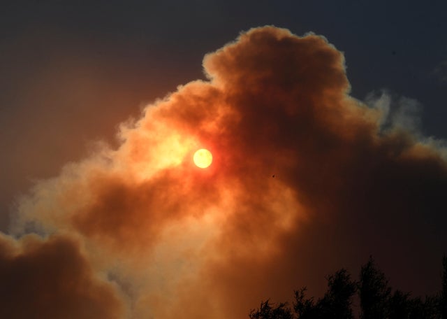 The morning sun is block by the thick smoke from an early-morning Creek Fire that broke out in the Kagel Canyon area in the San Fernando Valley north of Los Angeles in Sylmar