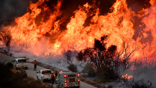 Fire fighters attack the Thomas Fire’s north flank with backfires as they continue to fight a massive wildfire north of Los Angeles, near Ojai , California 