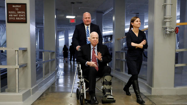 Sen. John McCain heads to the Senate floor ahead of votes on Capitol Hill in Washington 