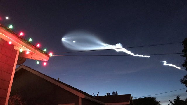 SpaceX's Falcon 9 rocket lifts off in the air, as seen from El Sugundo, California 