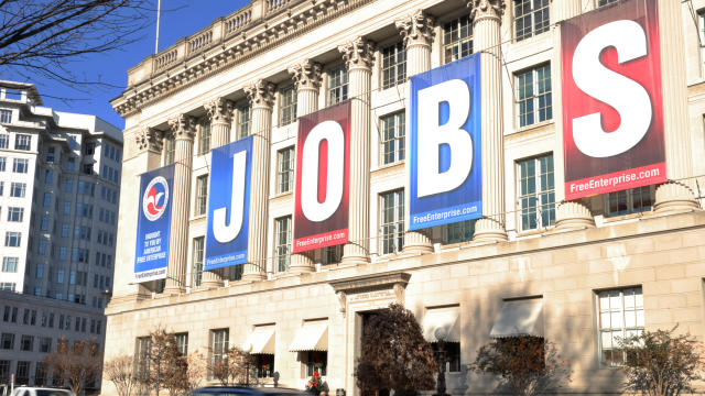 A jobs sign hangs above the entrance to 