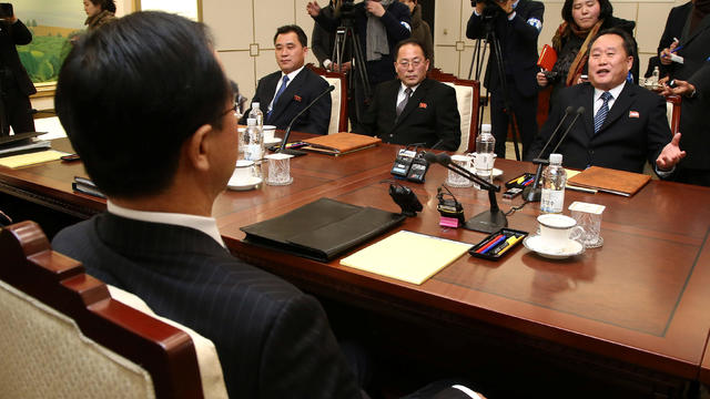 Head of the North Korean delegation, Ri Son Gwon talks with his South Korean counterpart Cho Myoung-gyon during their meeting at the truce village of Panmunjom 