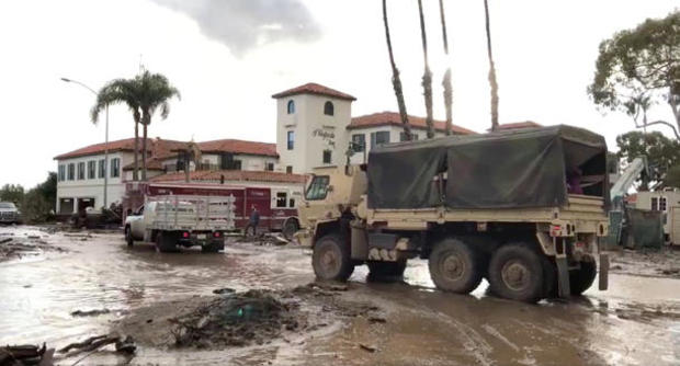 Military vehicles arrive to assist evacuation operations at an area damaged by mudslides in Montecito, California, U.S. 