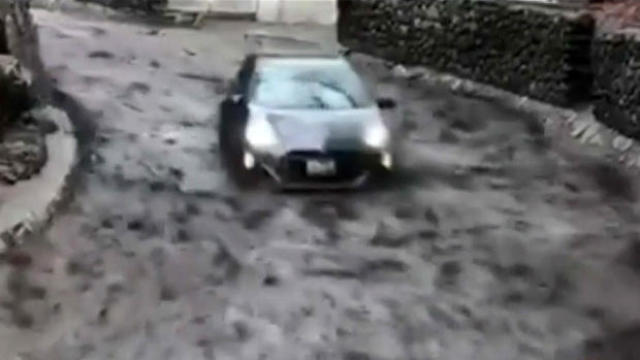 A Toyota Prius was swept up by mud and carried downhill during a rainstorm in Burbank, California, on Jan. 10, 2018. 