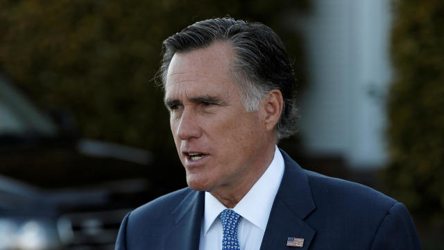 FILE PHOTO: Former Massachusetts Governor Mitt Romney speaks to members of the media at Trump National Golf Club in Bedminster 