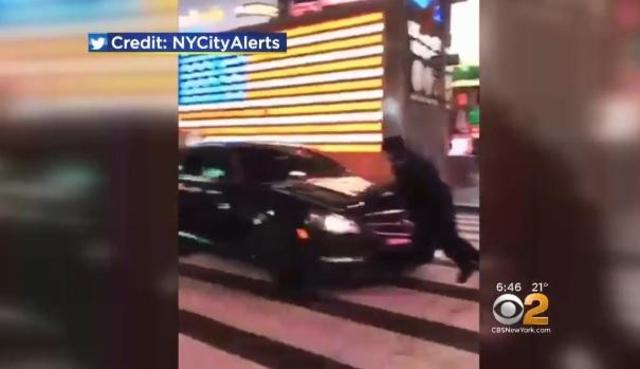 Driver who hit NYPD officer in Times Square remains at large - CBS News