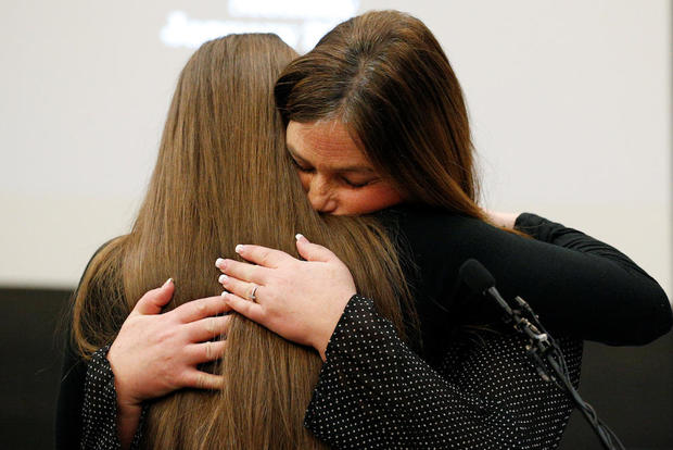 Victim Emma Ann Miller is embraced by her mother Leslie Miller at the sentencing hearing for Larry Nassar, a former team USA Gymnastics doctor who pleaded guilty in November 2017 to sexual assault charges, in Lansing 