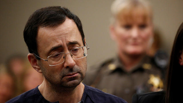 Larry Nassar, a former team USA Gymnastics doctor who pleaded guilty in November 2017 to sexual assault charges, stands during his sentencing hearing in Lansing, Mich., on Wed., Jan. 24, 2018. 