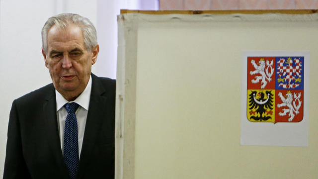 Incumbent president Milos Zeman arrives to vote at a polling station during the second round of the presidential election in Prague 