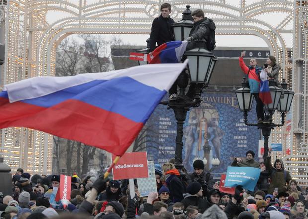People gather in a square during a rally of supporters of Russian opposition leader Navalny in Moscow 