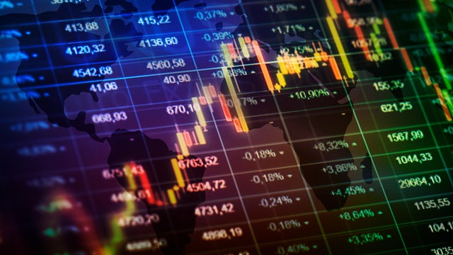 Computer monitor with trading software. Multiple exposure photog 