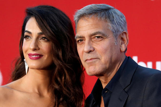 Director George Clooney and his wife Amal attend the premiere for "Suburbicon" in Los Angeles, California, Oct. 22, 2017. 