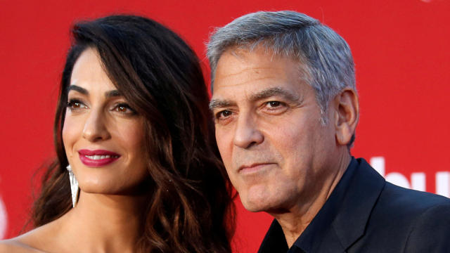 Director George Clooney and his wife Amal attend the premiere for "Suburbicon" in Los Angeles, California, Oct. 22, 2017. 