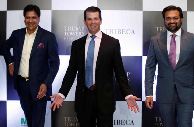 Donald Trump Jr. gestures as Basant Bansal, Chairman and Managing Director of M3M India and Kalpesh Mehta, founder of Tribeca Developers, look on during a photo opportunity before start of a meeting in New Delhi 
