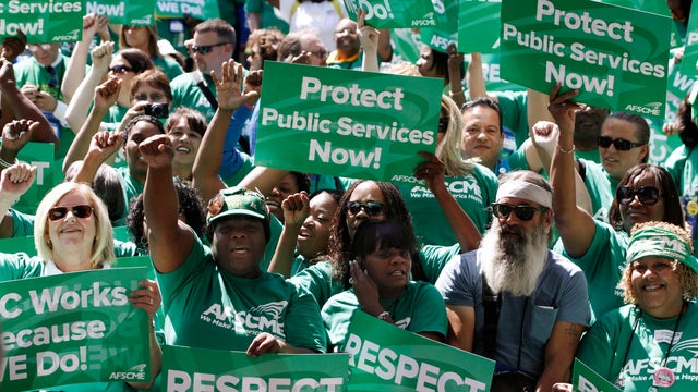 Union members cheer during a rally held by the American Federation of State, County and Municipal Employees in Los Angeles 