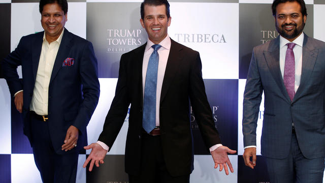 Donald Trump Jr. gestures as Basant Bansal, Chairman and Managing Director of M3M India and Kalpesh Mehta, founder of Tribeca Developers, look on during a photo opportunity before start of a meeting in New Delhi 